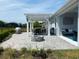 Outdoor patio with pergola, fire pit, and dining furniture at 4552 Sequel Rd, Kissimmee, FL 34746