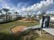 Community playground with slides, climbing structures, and benches at 4552 Sequel Rd, Kissimmee, FL 34746