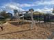 playground with climbing equipment, a slide, and shade structures at 4552 Sequel Rd, Kissimmee, FL 34746