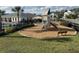A playground with a slide, climbing area, benches, and a nearby pool at 4552 Sequel Rd, Kissimmee, FL 34746