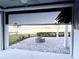 Sunken patio with retractable screen, offering shade and lake views at 4552 Sequel Rd, Kissimmee, FL 34746