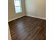 Bedroom with dark wood flooring at 7952 Wandering Way, Orlando, FL 32836