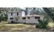 Two-story house needing renovations, featuring a large yard at 242 Oak Hill Rd, Lady Lake, FL 32159