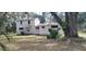Two-story house needing renovations, featuring a large yard at 242 Oak Hill Rd, Lady Lake, FL 32159