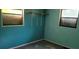 Bedroom with teal walls and wood flooring at 242 Oak Hill Rd, Lady Lake, FL 32159