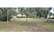 Vacant lot with mature trees and a large grassy area at 242 Oak Hill Rd, Lady Lake, FL 32159