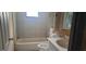 Bathroom with bathtub, toilet and sink at 242 Oak Hill Rd, Lady Lake, FL 32159