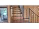 Wooden staircase with metal railing at 242 Oak Hill Rd, Lady Lake, FL 32159