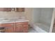 Bathroom with double vanity and bathtub at 242 Oak Hill Rd, Lady Lake, FL 32159