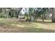 Vacant lot with mature trees and a large grassy area at 242 Oak Hill Rd, Lady Lake, FL 32159