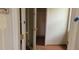 Small bedroom with mirrored closet doors and wood flooring at 242 Oak Hill Rd, Lady Lake, FL 32159