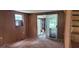 Room with wood paneling and sliding glass door at 242 Oak Hill Rd, Lady Lake, FL 32159