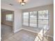 Bright sunroom with tile floor and view into the living room at 312 E Broadway, Fort Meade, FL 33841