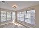 Sunroom with tile floor, large windows, and blinds at 312 E Broadway, Fort Meade, FL 33841