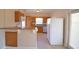Modern kitchen with wood cabinets and stainless steel appliances at 312 E Broadway, Fort Meade, FL 33841