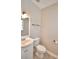 Clean bathroom with vanity, toilet, and window at 312 E Broadway, Fort Meade, FL 33841