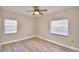 Bright bedroom with wood-look floors and ceiling fan at 312 E Broadway, Fort Meade, FL 33841