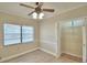 Bedroom with ceiling fan, window, and spacious closet at 312 E Broadway, Fort Meade, FL 33841