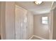 Laundry room with shelving, water heater, and brick accent wall at 312 E Broadway, Fort Meade, FL 33841