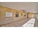 Covered screened porch with tile flooring and ceiling fans at 312 E Broadway, Fort Meade, FL 33841