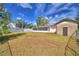 Backyard with screened patio and storage building at 312 E Broadway, Fort Meade, FL 33841