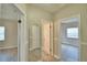 Hallway with mirror and access to bedrooms and bathroom at 312 E Broadway, Fort Meade, FL 33841