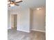Living room with wood-look floors and access to other rooms at 312 E Broadway, Fort Meade, FL 33841