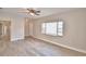 Living room with wood-look floors and a view to the entryway at 312 E Broadway, Fort Meade, FL 33841