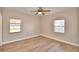 Bright bedroom with ceiling fan and wood-look flooring at 312 E Broadway, Fort Meade, FL 33841