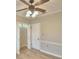 Bedroom with ceiling fan, window, and spacious closet at 312 E Broadway, Fort Meade, FL 33841