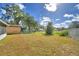 Large backyard with open space and trees at 312 E Broadway, Fort Meade, FL 33841