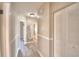 Bright hallway with light flooring, leading to bedrooms and bathroom at 312 E Broadway, Fort Meade, FL 33841