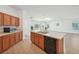 Modern kitchen with island and dishwasher at 1383 Pompay Dr, Davenport, FL 33896