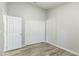 Bedroom with double door closet and wood-look floors at 2729 Wilshire Rd, Clermont, FL 34714