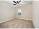 Spacious bedroom with neutral walls, carpet flooring, and ceiling fan at 7737 Somersworth Dr, Kissimmee, FL 34747