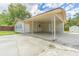Covered carport with access to home and backyard at 910 N Lincoln Ave, Lakeland, FL 33815