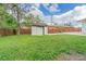 Backyard with shed and wooden fence at 910 N Lincoln Ave, Lakeland, FL 33815