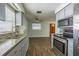 Modern kitchen with granite countertops and stainless steel appliances at 910 N Lincoln Ave, Lakeland, FL 33815