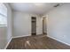 Simple bedroom with wood-look floors and a closet at 910 N Lincoln Ave, Lakeland, FL 33815