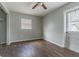 Simple bedroom with wood-look floors, a closet, and exterior access at 910 N Lincoln Ave, Lakeland, FL 33815