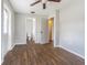 Bedroom with wood-look floors, and access to bathroom at 910 N Lincoln Ave, Lakeland, FL 33815
