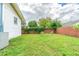 Grass backyard with wooden privacy fence at 910 N Lincoln Ave, Lakeland, FL 33815