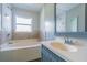 Clean bathroom with a bathtub and vanity sink at 910 N Lincoln Ave, Lakeland, FL 33815