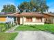 Front view of a single-story house with a lawn and walkway at 1057 Old South Dr, Lakeland, FL 33811