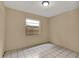 Bright bedroom with tile floors and a window at 1057 Old South Dr, Lakeland, FL 33811