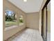 Sunroom with tile floor and sliding glass door at 1057 Old South Dr, Lakeland, FL 33811