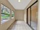 Sunroom with tile floor and sliding glass door at 1057 Old South Dr, Lakeland, FL 33811