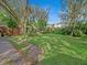 Large backyard with mature trees and grassy area at 1057 Old South Dr, Lakeland, FL 33811