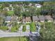 Aerial view of a row of houses, including a tan house with solar panels at 1057 Old South Dr, Lakeland, FL 33811