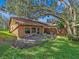 Large backyard with a detached structure and a wooden fence at 1057 Old South Dr, Lakeland, FL 33811